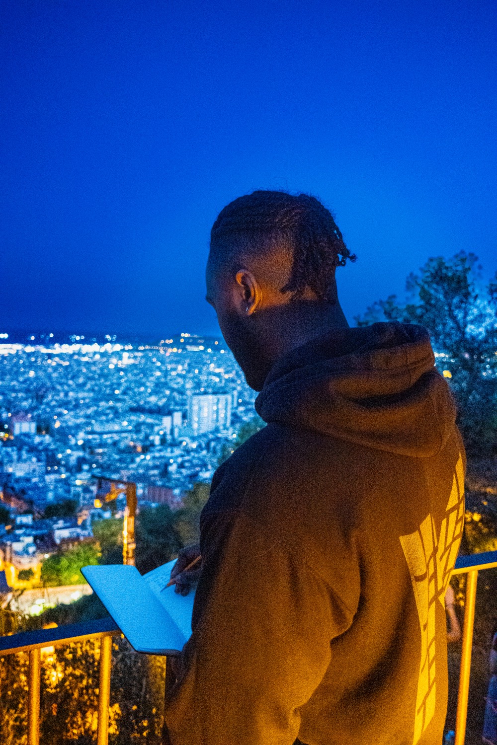 Blue hour over Barcelona, writing in a notebook above the city lights